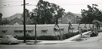 domed huts on a college lawn