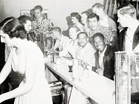 Smiling students at a lunch counter