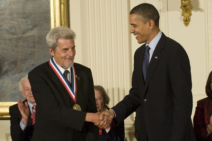 president shaking hands with man