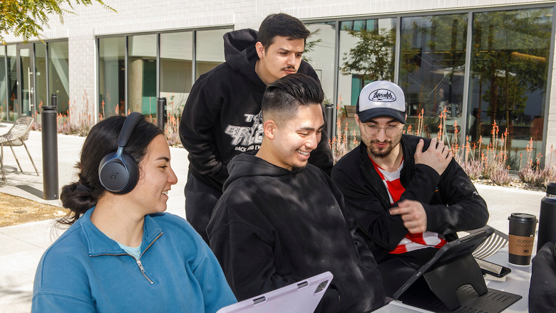 Students working on laptops on Rinker Campus.