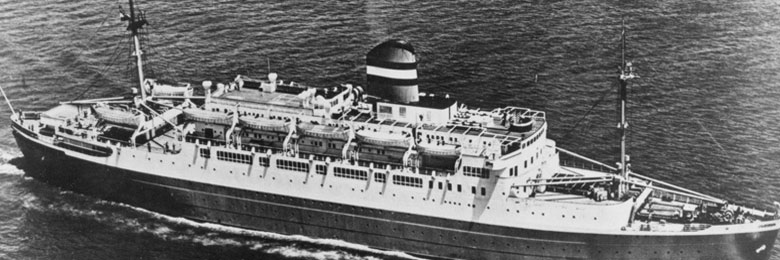 black and white photo of a boat on the ocean