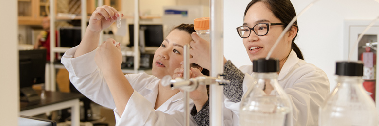 Two chapman science students in a lab