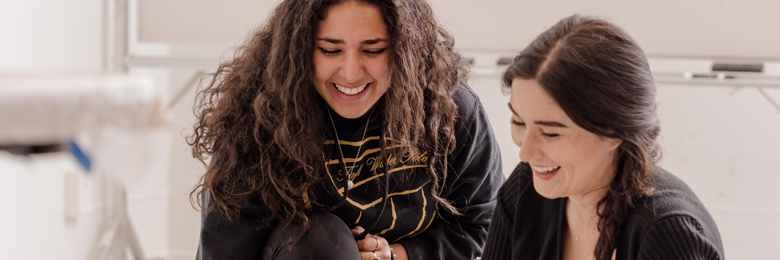 two chapman student smiling 