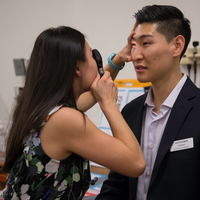 Student giving eye exam