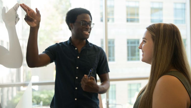 A student working with a professor