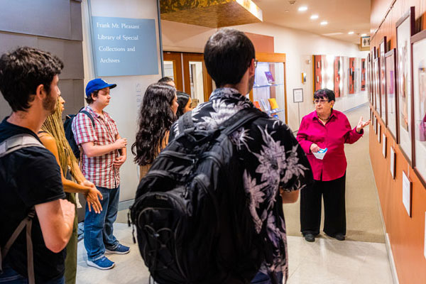 Faculty member leads tour of students on campus