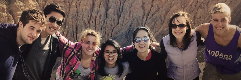 Chapman students on a camping trip posing for a photo.