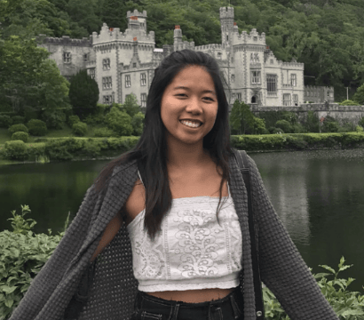 Student in front of European palace.