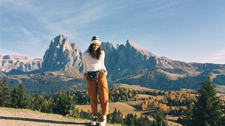 Chapman University student poses with Swiss Alps in background while studying abroad