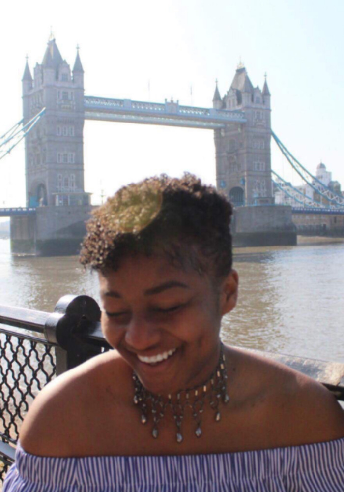 Student in front of London Bridge.