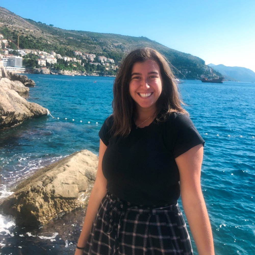 Student on the ocean shoreline