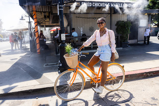 student on bicycle in old towne