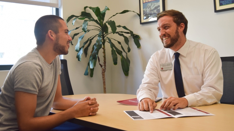 Admission counselor talking to a student