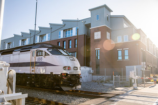 students sitting in front of train