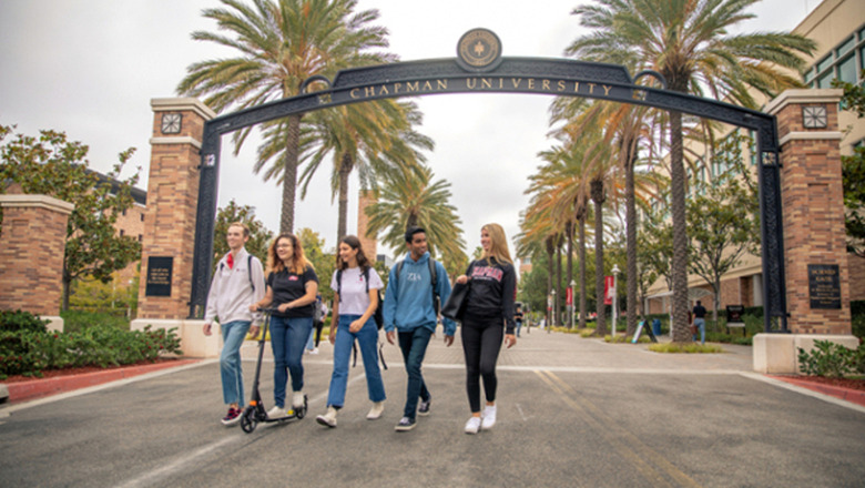 students underneath arch