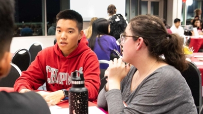 Students talking at a table