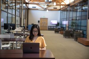 A student working on her computer