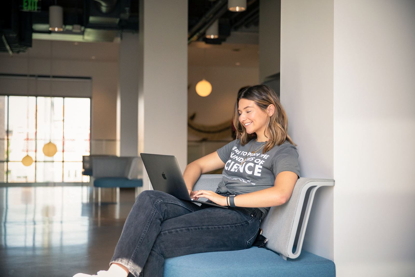 A female Chapman student working on a computer