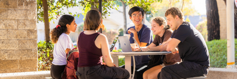 Students gathered around a table