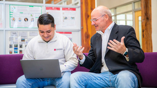 student working with professor