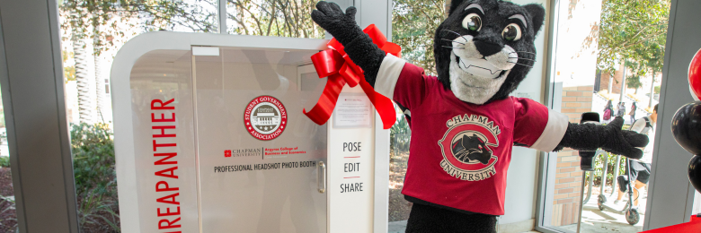 Pete the Panther celebrating the opening of the new headshot photo booth in the lobby of Beckman Hall