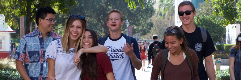 Group photo of students walking across Chapman University campus in Orange, CA