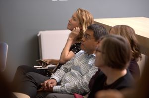 Students sit in a lecture in a classroom.