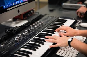 A student plays a keyboard