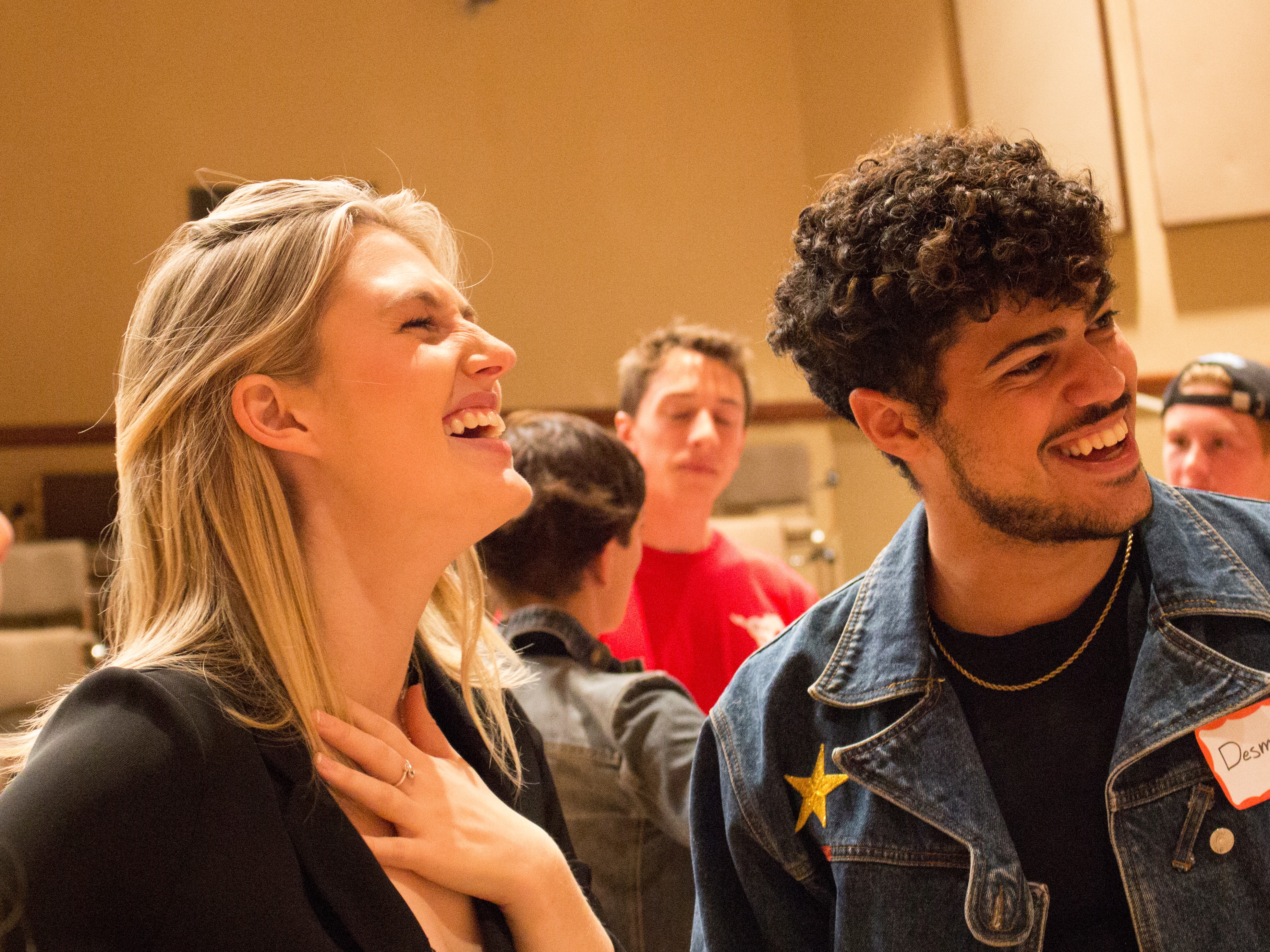 smiling music students at an information session