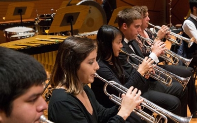 Students performing on musical instruments