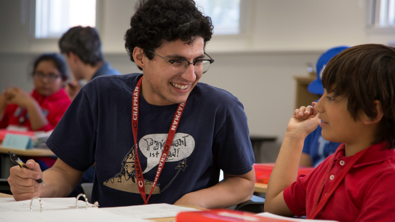 teacher and student smiling