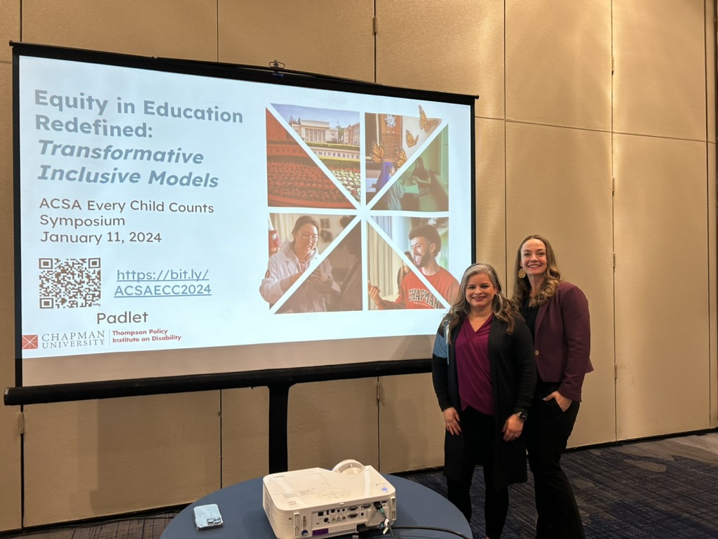 women standing in front of their presentation 