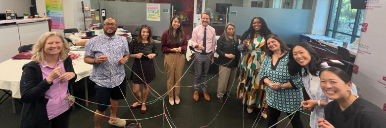 half circle of people connected with string 