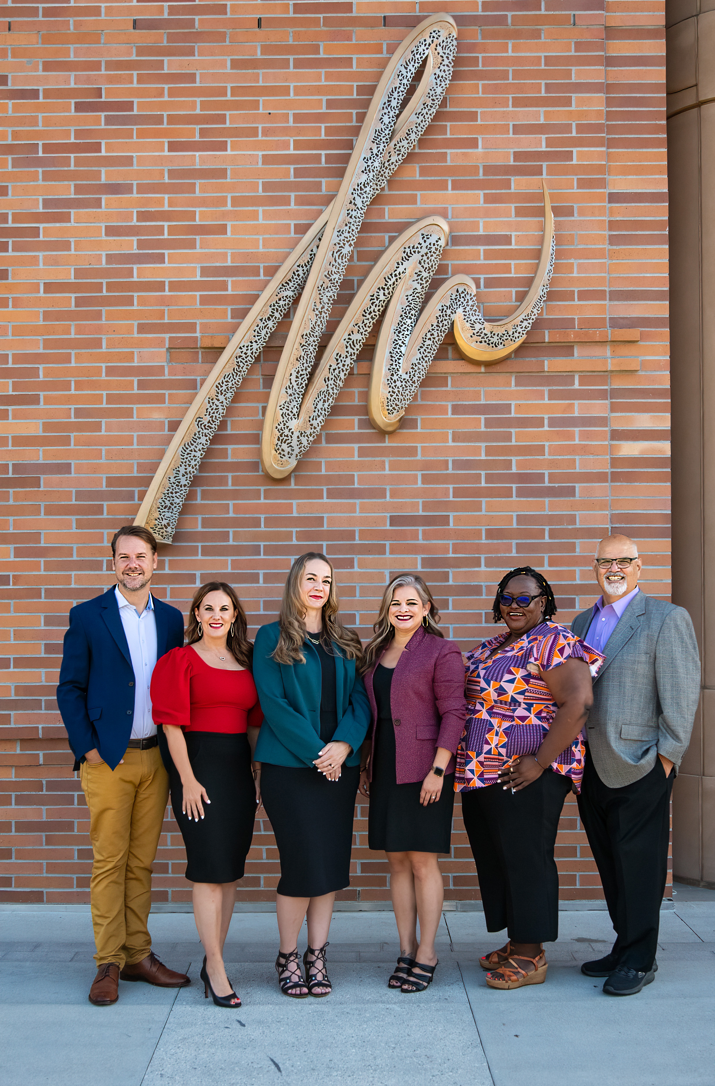 TPI team standing in front of Musco Center for the Arts