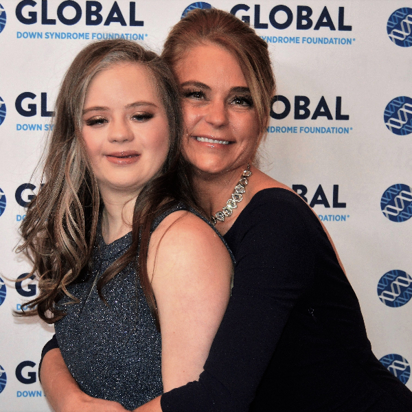 Megan and Kris Bomgaars are pictured in formal attire at an event