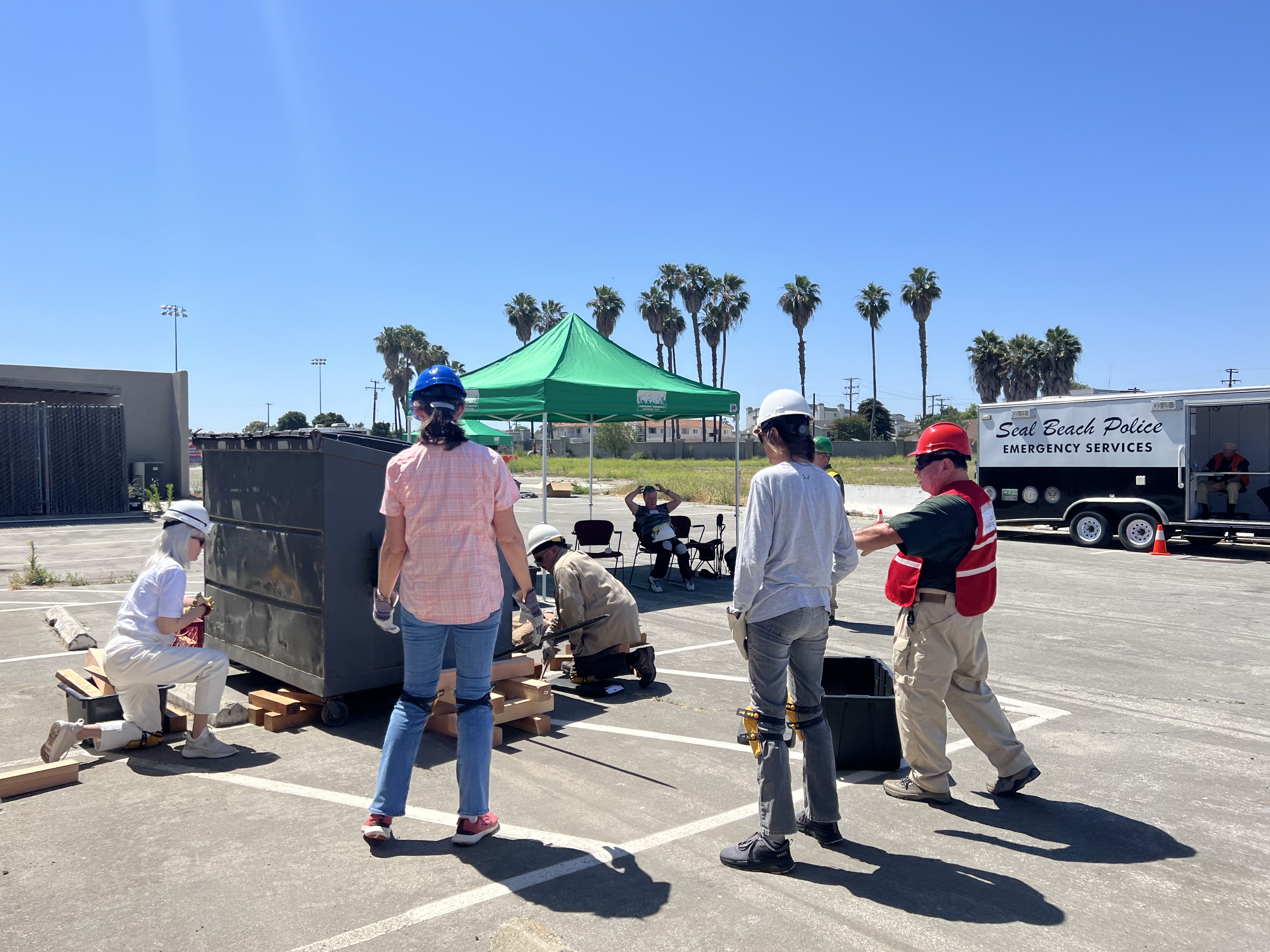 cert members lifting a dumpster with cribbing