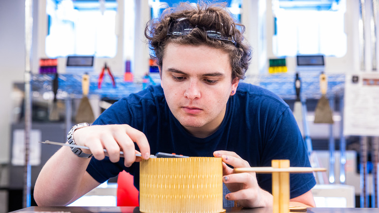 A student constructing a device for Make-a-Thon.