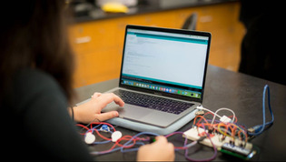 Student working on a laptop