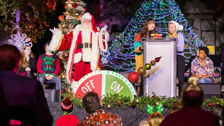 Santa on festively decorated stage at Chapman University's Winterfest event