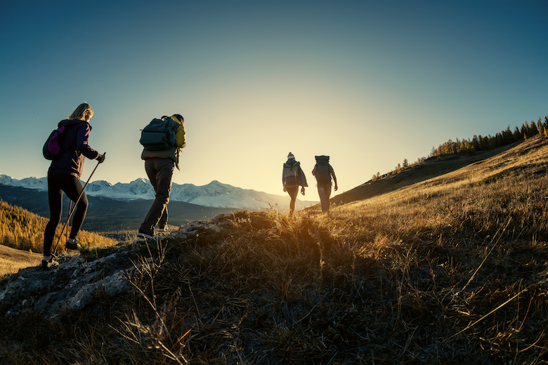 Young people hiking a mountain