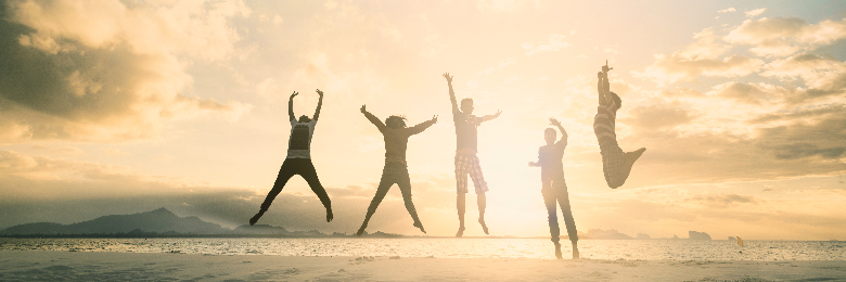 Family Jumping at the Beach