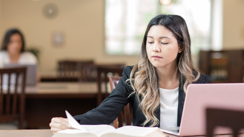 Law student in library studying