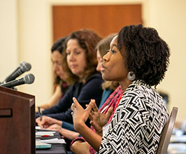 panelists discuss at table 