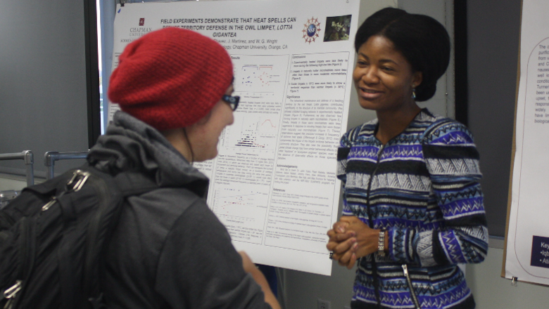 Chapman student explains research.