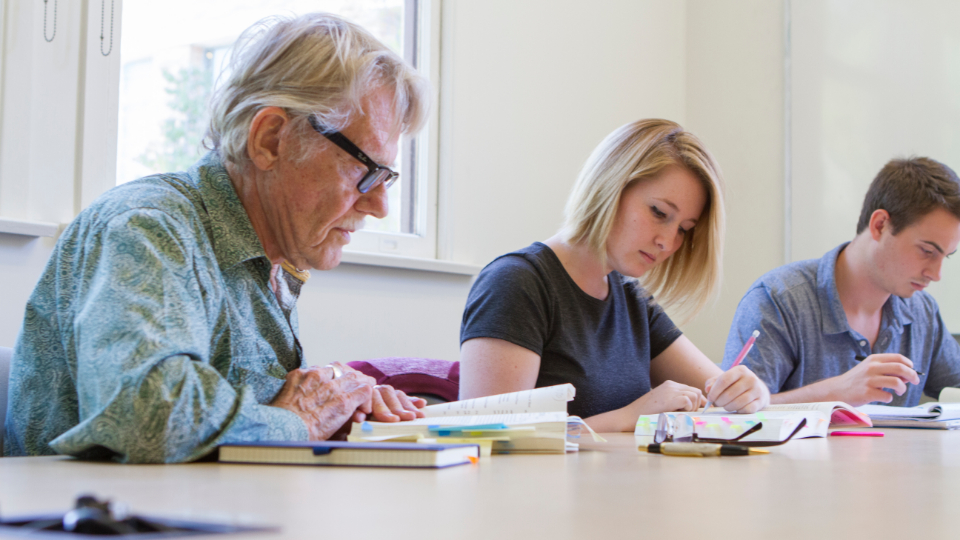 Dr. Vernon Smith going over reading with students