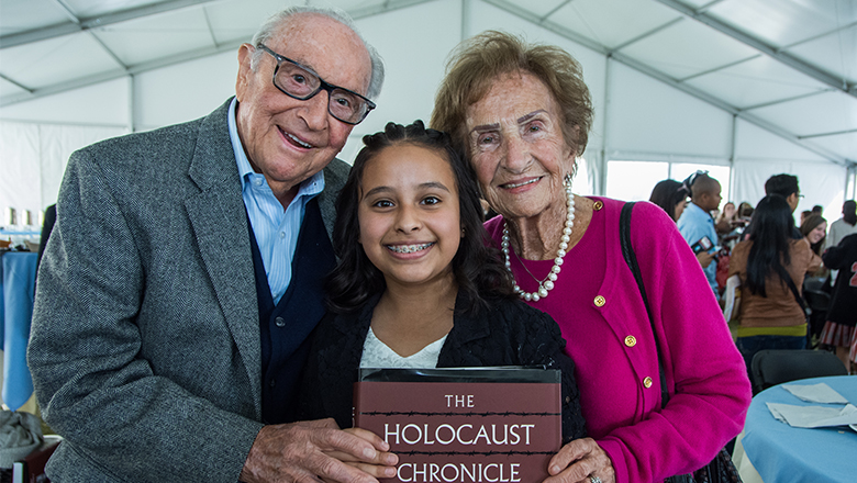 Natan and Fela Gipsman pose with middle school filmmaker Kimberley Sanchez