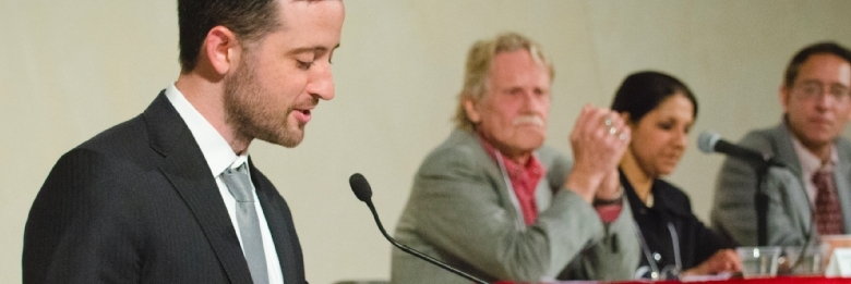 Man giving presentation at podium.