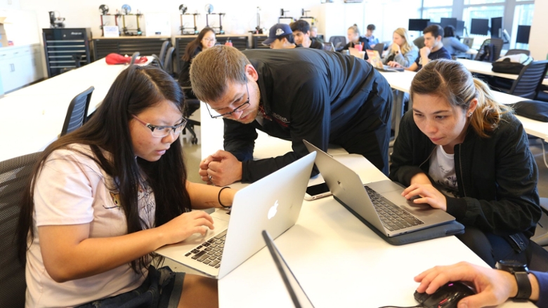 Students working on computers in a classroom