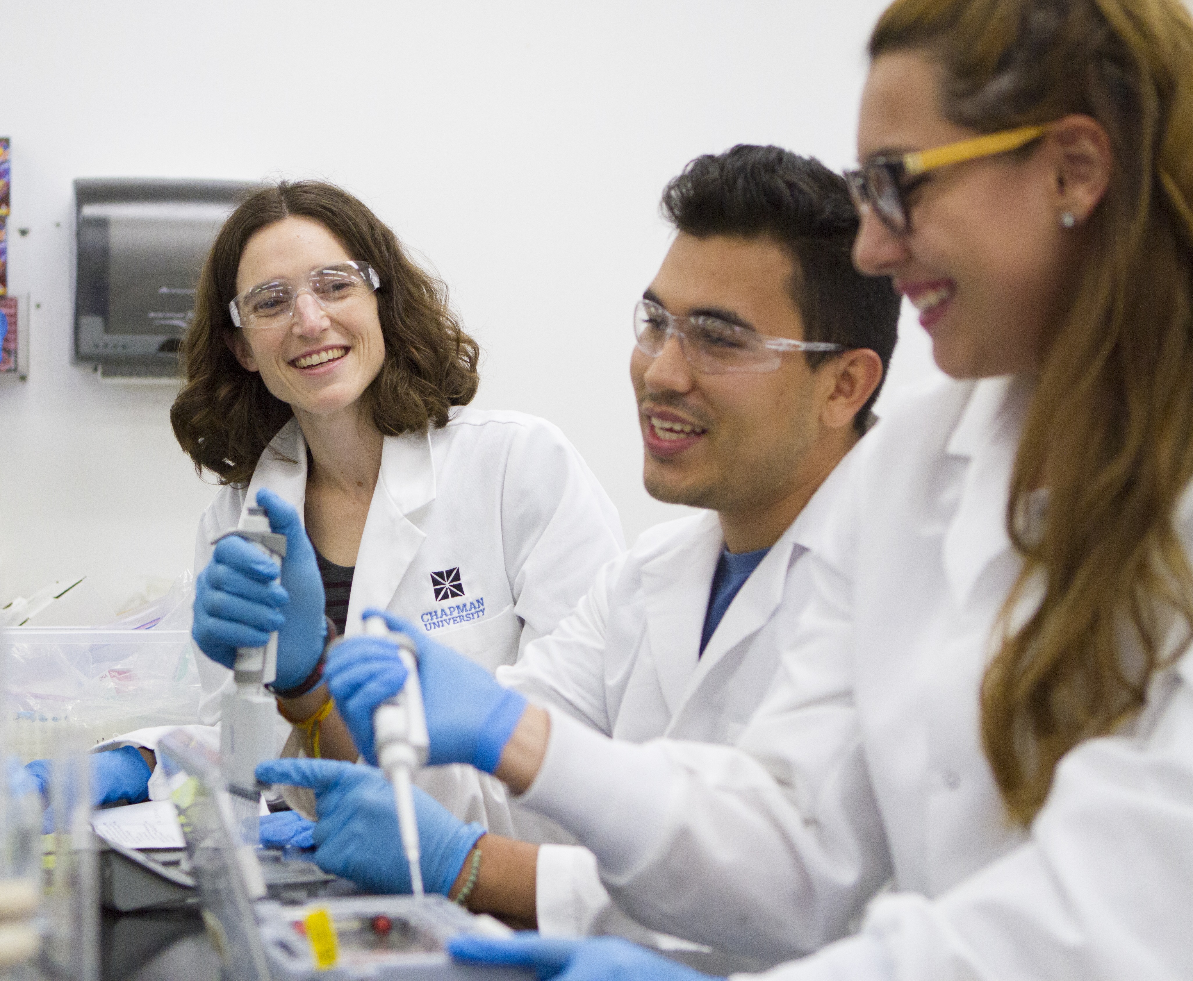 Professor and students in lab.