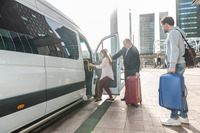 person getting into van at airport